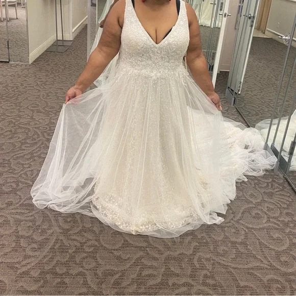 This wedding dress is a size 20. Brand New and had never been worn before.